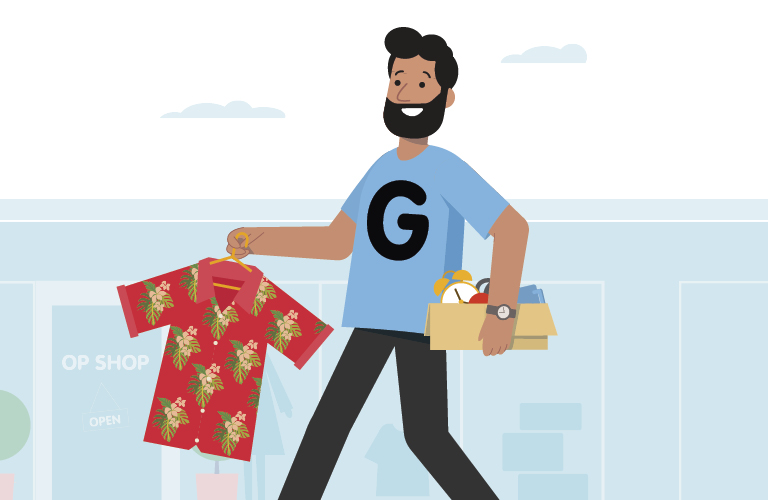 Man with 'G' (for gifting) on his shirt carrying an old shirt and items to give to charity